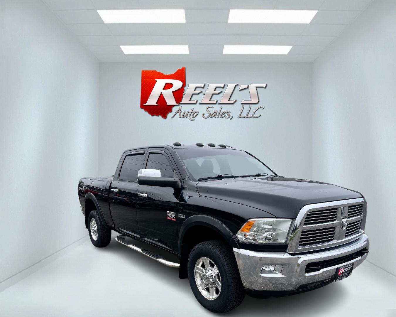 2012 Black /Black Dodge Ram 2500 Laramie Crew Cab SWB 4WD (3C6TD5FT6CG) with an 5.7L V8 OHV 16V engine, 6-Speed Automatic transmission, located at 547 E. Main St., Orwell, OH, 44076, (440) 437-5893, 41.535435, -80.847855 - This 2012 Dodge Ram 2500 Laramie Crew Cab is a heavy-duty pickup truck designed for serious towing and hauling capabilities. Powered by a 5.7L HEMI V8 engine mated to a 6-speed automatic transmission and 3.73 gearing, it boasts an impressive 10,550-pound towing capacity. The interior is well-appoint - Photo#2